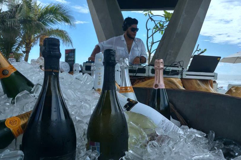 Beach club DJ booth with champagne on ice